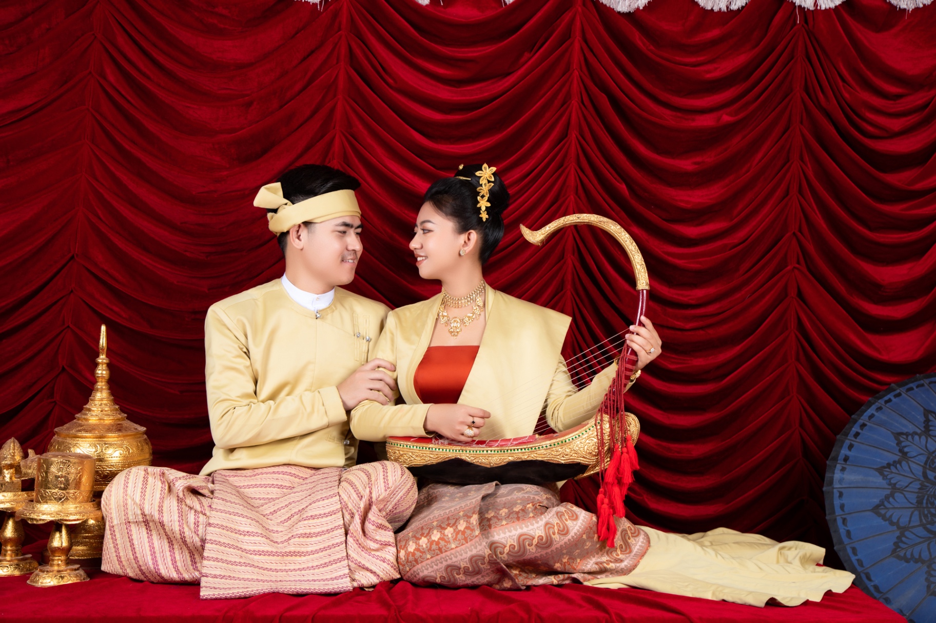 Traditional Myanmar solo portrait with harp and ceremonial décor